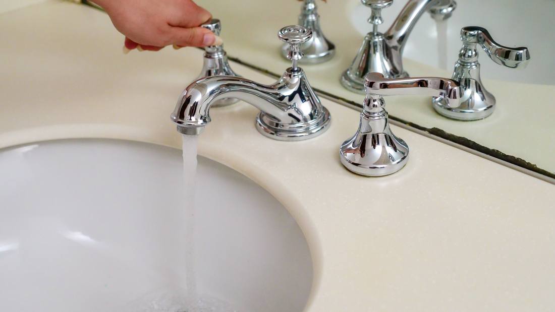 Water running from a bathroom faucet